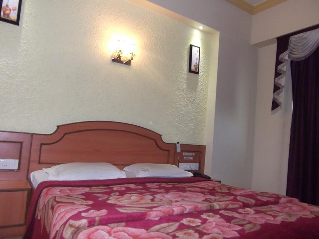 Hotel Ravikant プネ 部屋 写真